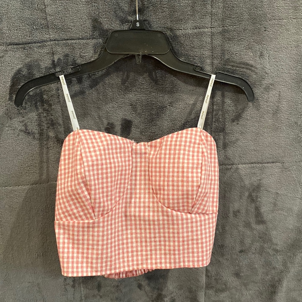 Red and white striped tube top. Size large but fits like a medium.